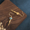 Handcrafted Nepalese-inspired Gold Earrings in Colorful Design